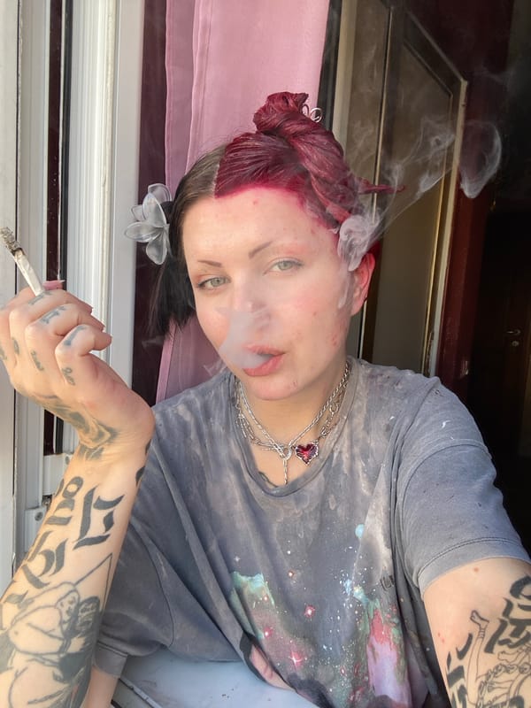 Person with red hair photographed smoking in Kunje, Montenegro