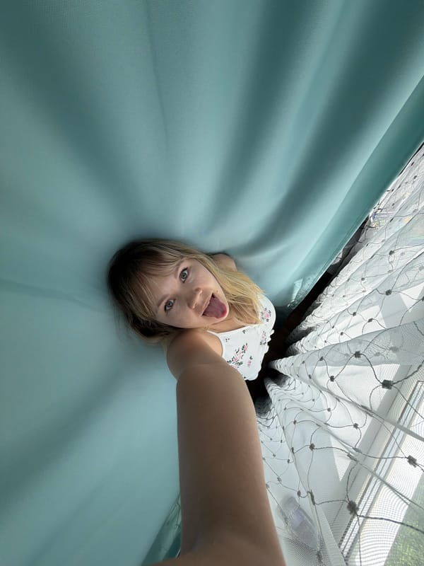 Woman takes morning selfies in bedroom in Chaikovsky, Russia