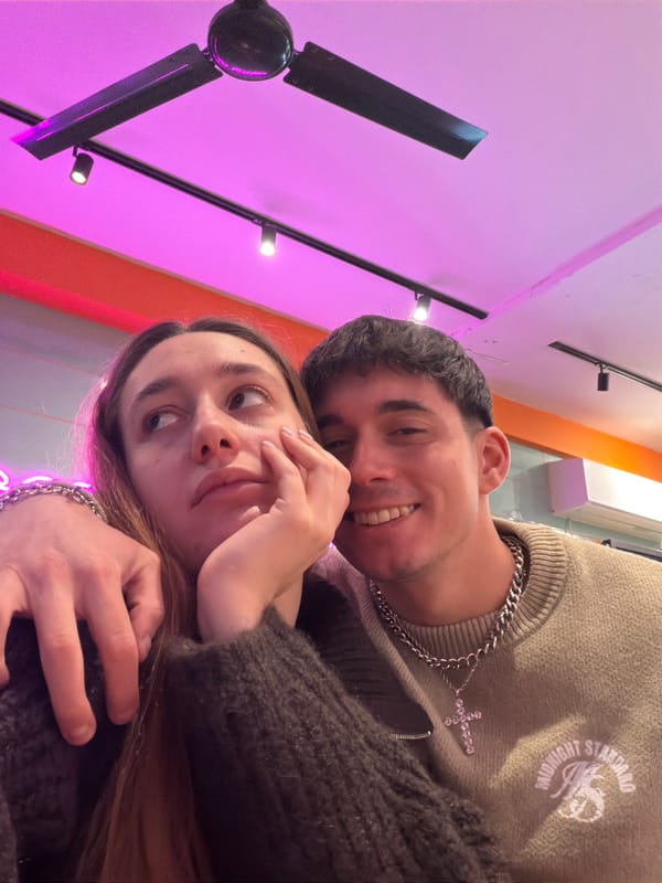 Young couple takes selfies during restaurant visit in Sofia