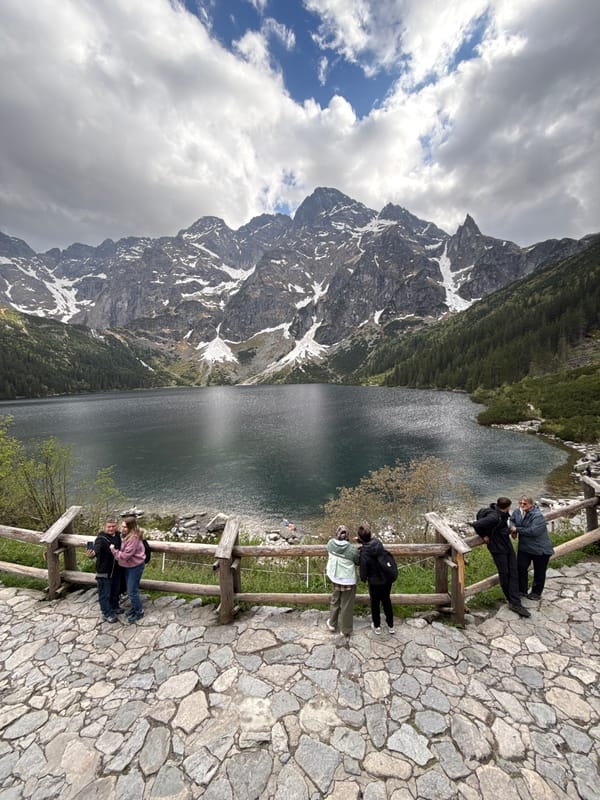Tourist visits Morskie Oko Lake in Polish Tatra Mountains