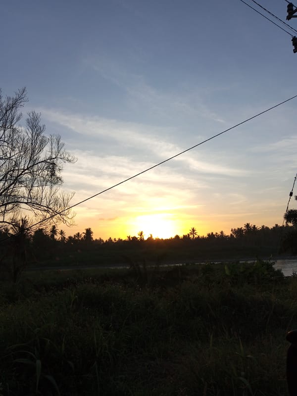 Drive through Indonesian village captures sunset industrial landscape