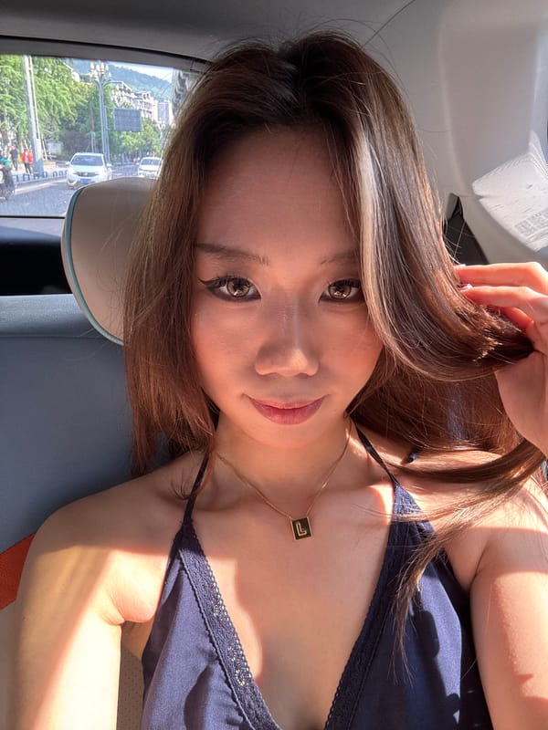 Woman photographed in vehicle passenger seat in Nan'an District