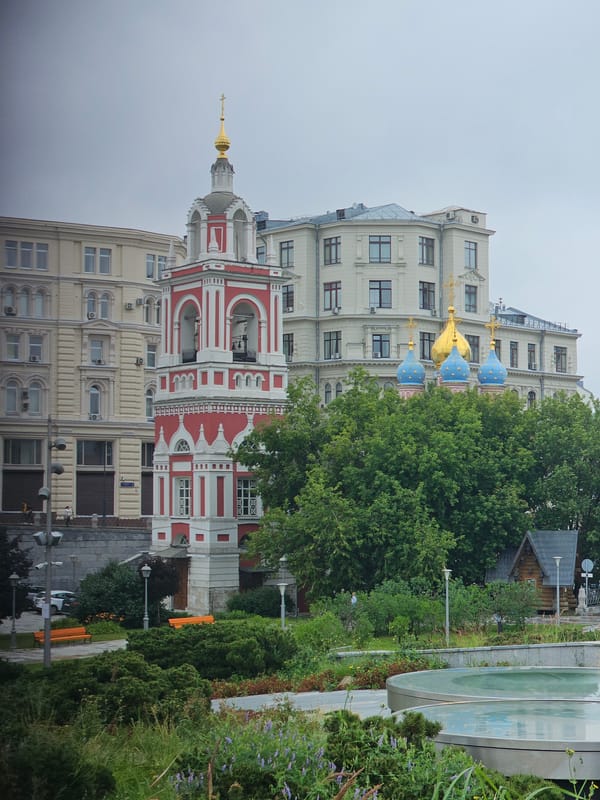 Orthodox churches and a grand metro station on a cloudy morning