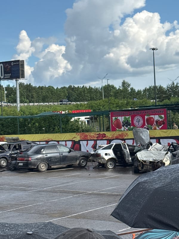 Outdoor automotive stunt show draws crowds of spectators