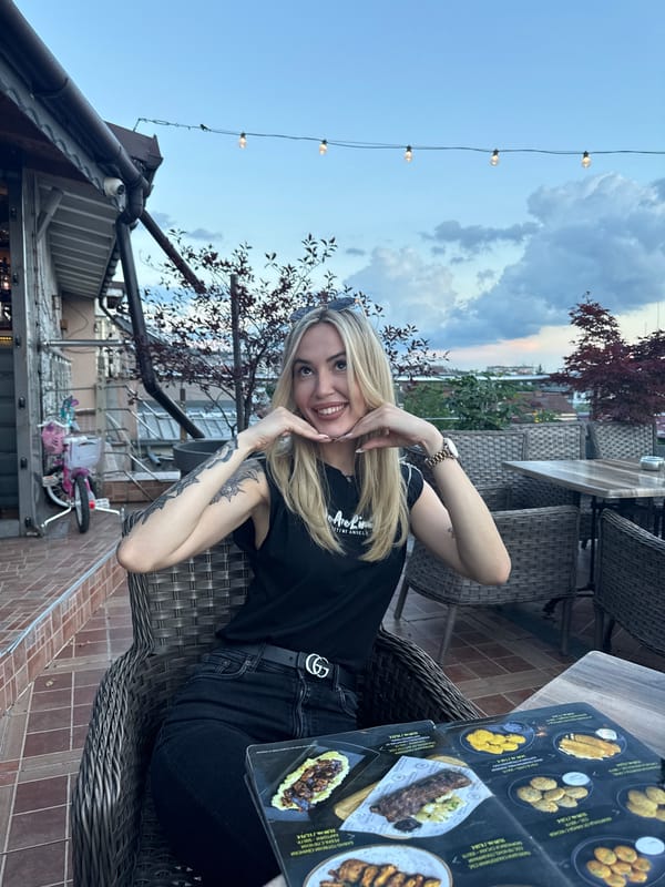 Woman dines outdoors in Ruse during evening hours