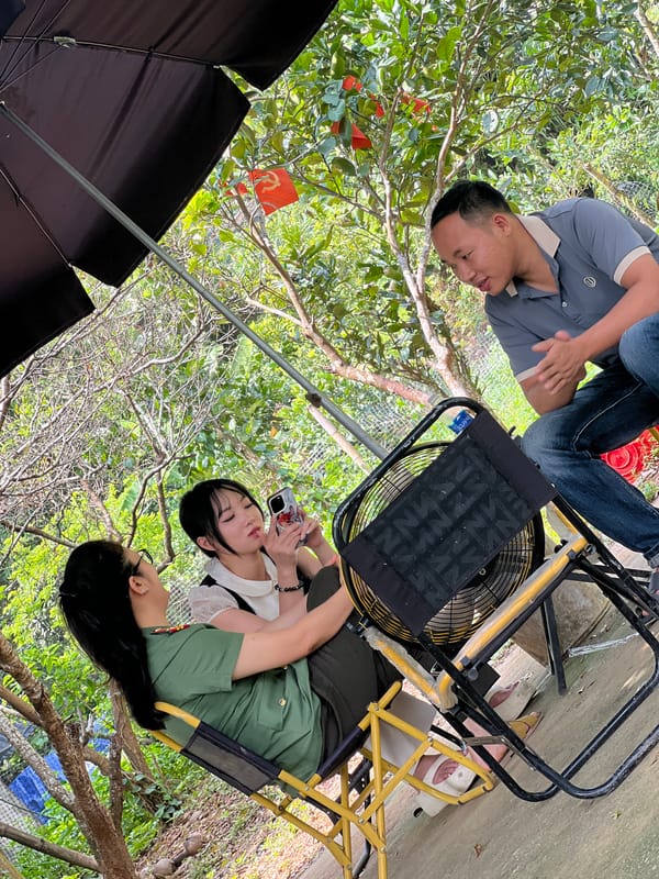 Casual outdoor gathering under the trees in Lai Đồng