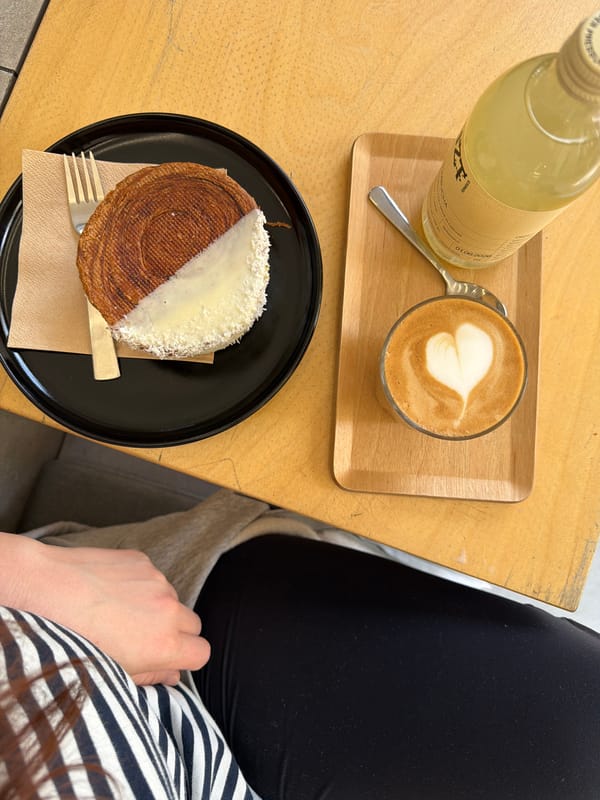 Morning cafe scene captured in Prague with kombucha and pastries