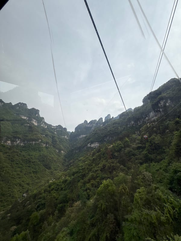 Tourist captures scenic mountain views from Zhangjiajie cable car