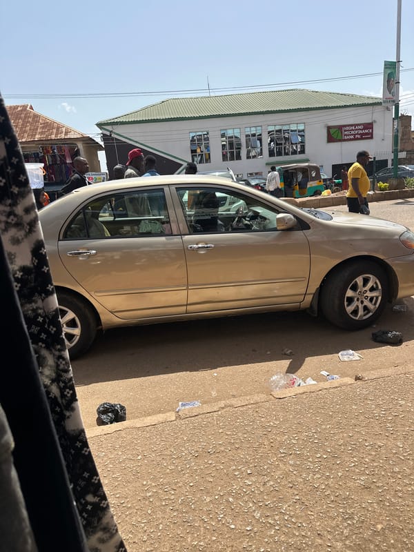 Midday street life and market activity in Bukuru, Nigeria