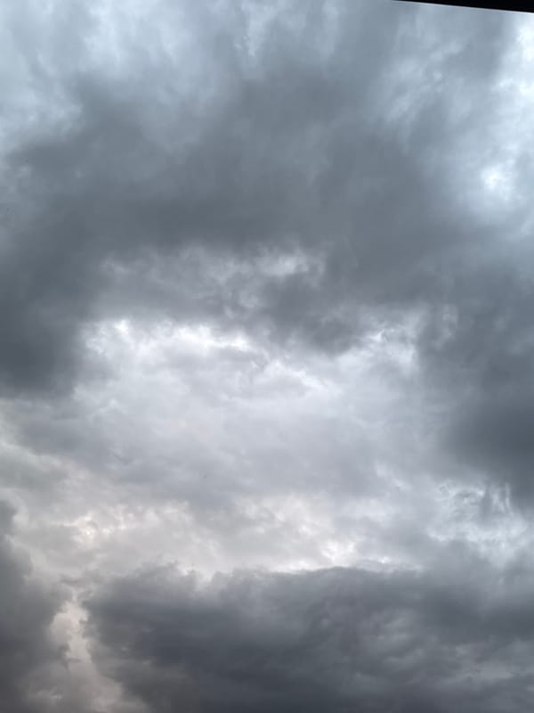 Storm clouds gather over residential area Thursday evening
