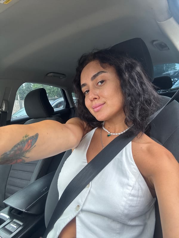 Car selfie in Tbilisi, pearl necklace detail front and center