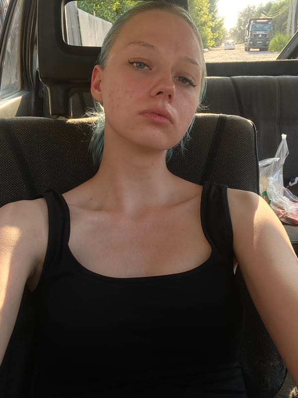 Chilling in a parked vehicle on a sunny Bishkek afternoon