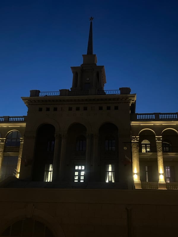 Krasnoyarsk nighttime cityscape documented across waterfront and grand architecture