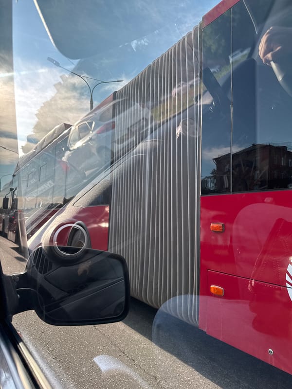 Red bus #27 spotted on Perm street during early morning