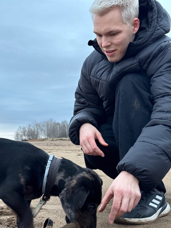 Man reaches out to dog in Chaikovsky, Russia