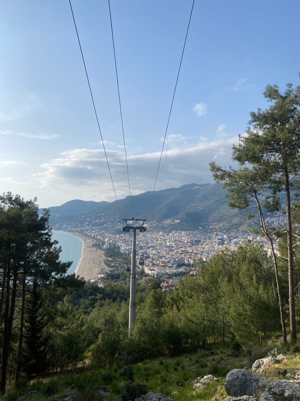 Cable car tour documents Alanya's coastal cityscape and mountains