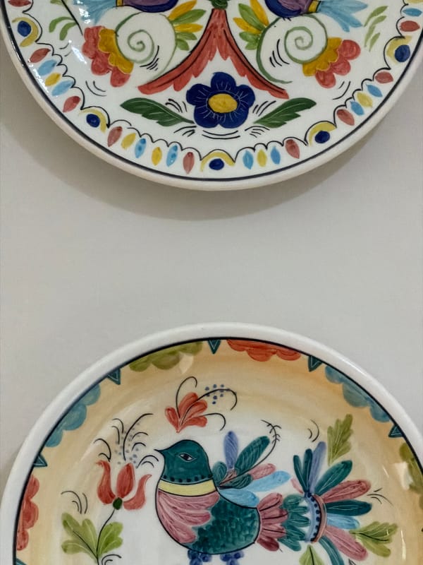 Decorative plates and sparkling water documented in Buford home