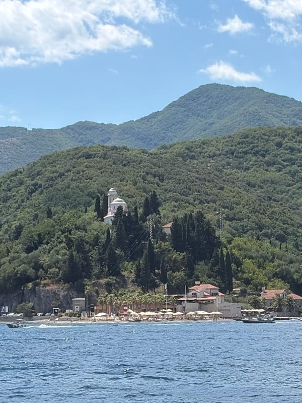 Lazy summer afternoon on a Bay of Kotor pebble beach