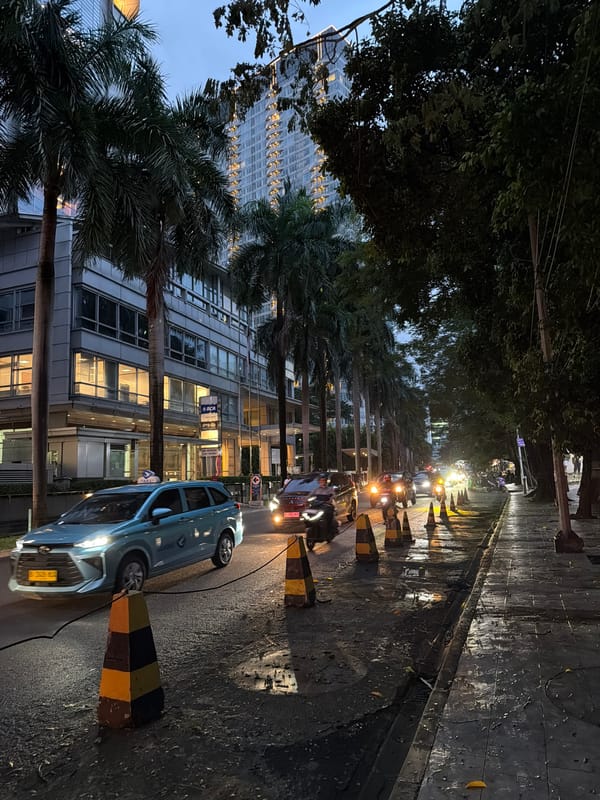 Wet street scene captured in South Jakarta commercial district