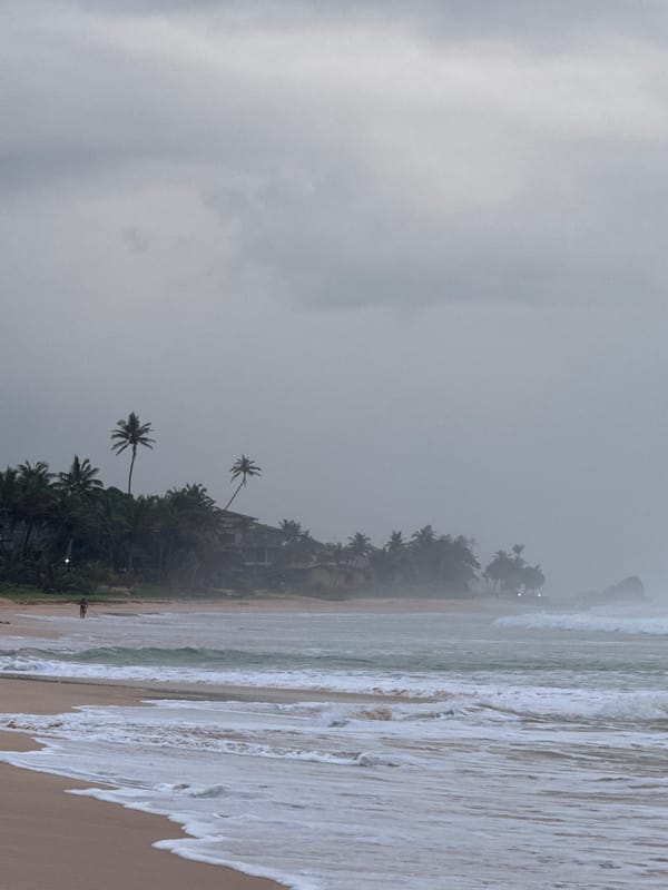 Koggala beach on a moody afternoon, moon out in daylight