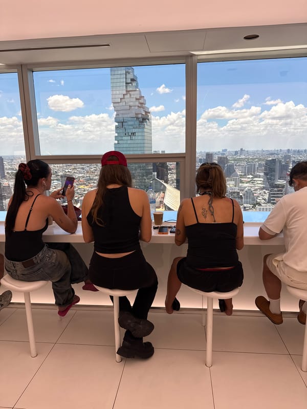 Early morning coffee shop visitors enjoy Bangkok skyline views