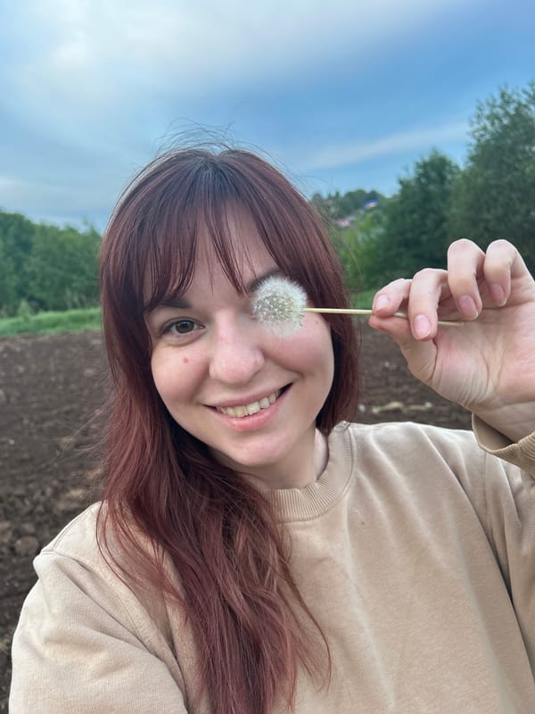Woman gardens and poses with flowers near Фоки, Russia