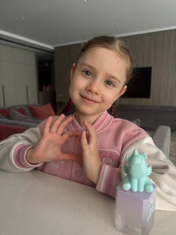 Girl poses for photo in varsity jacket in Engels