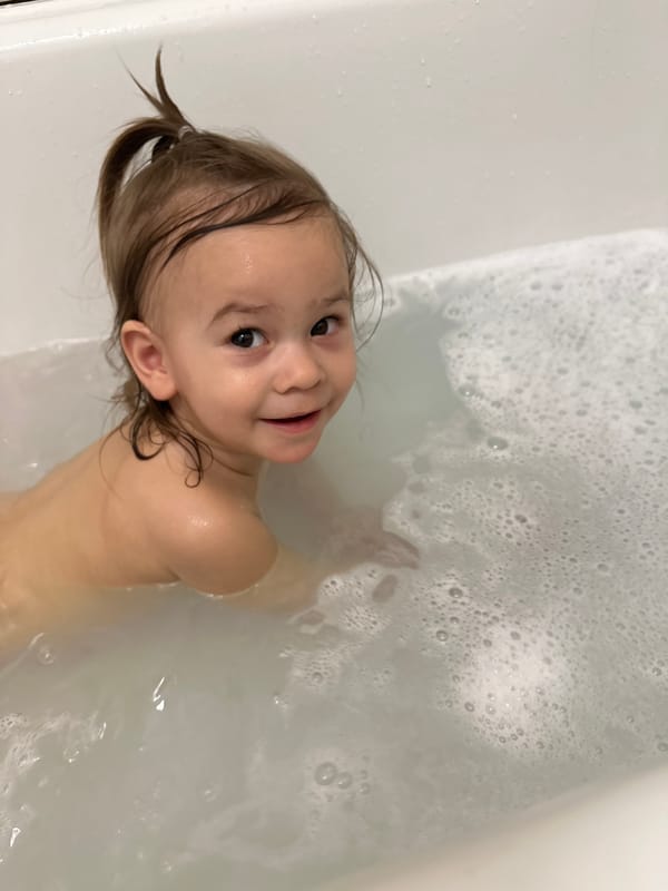 Child enjoys bubble bath in Kharnavy, Russia