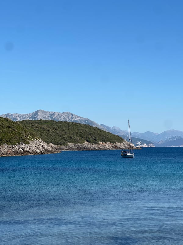 Person enjoys scenic moment on Montenegro's Adriatic coastline