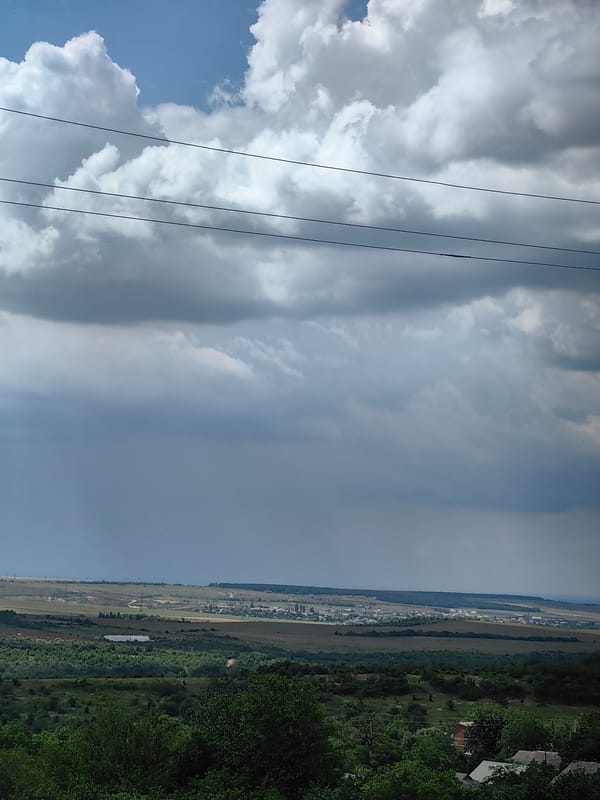 Storm clouds gather as strawberries harvested in rural area