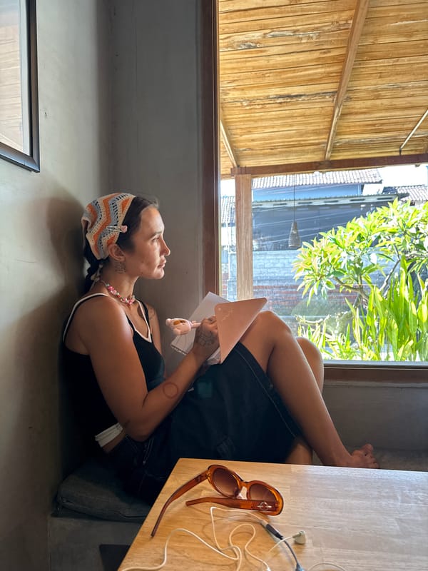 Quiet corner booth moment with a book in hand