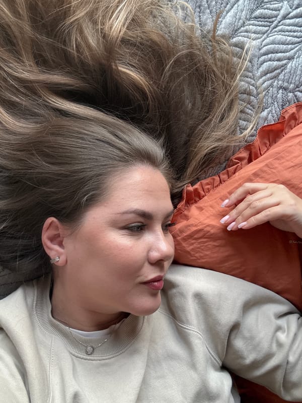 Woman resting on bed observed in Izhevsk, Russia