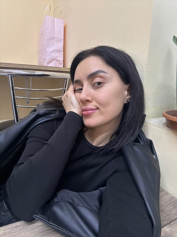 Woman photographed in multiple indoor settings around Tbilisi