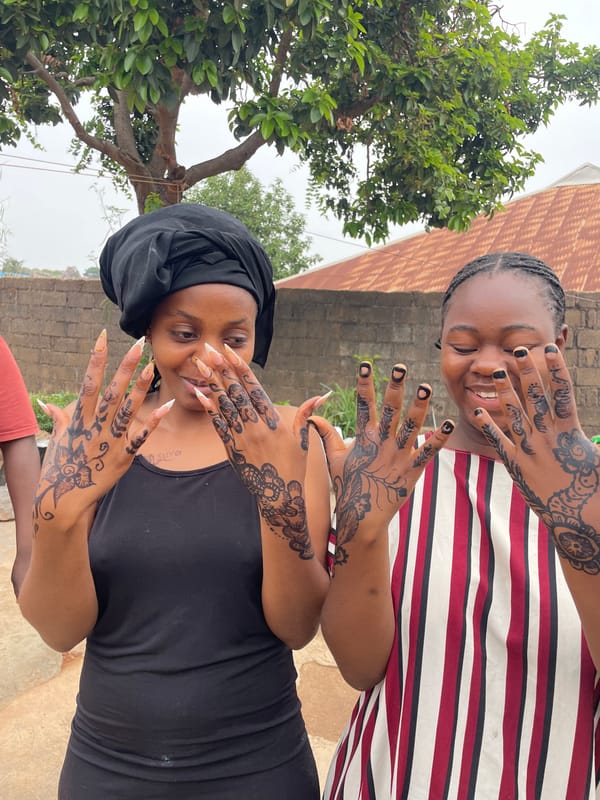 Women display henna hand art in Jos, Nigeria