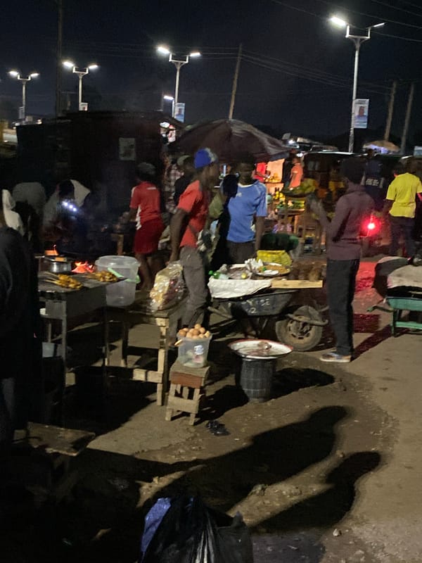 Nighttime food market bustles in Bukuru, Nigeria
