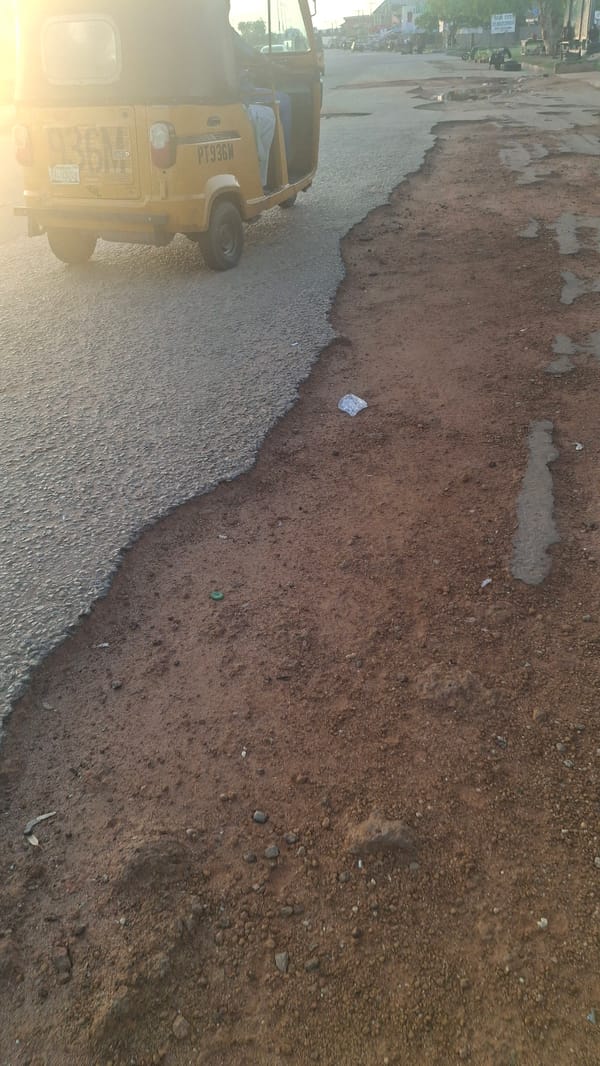 Jalingo streets at golden hour, mixed with simple word graphics
