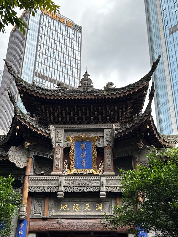 Traditional temple meets modern skyline in Chongqing district