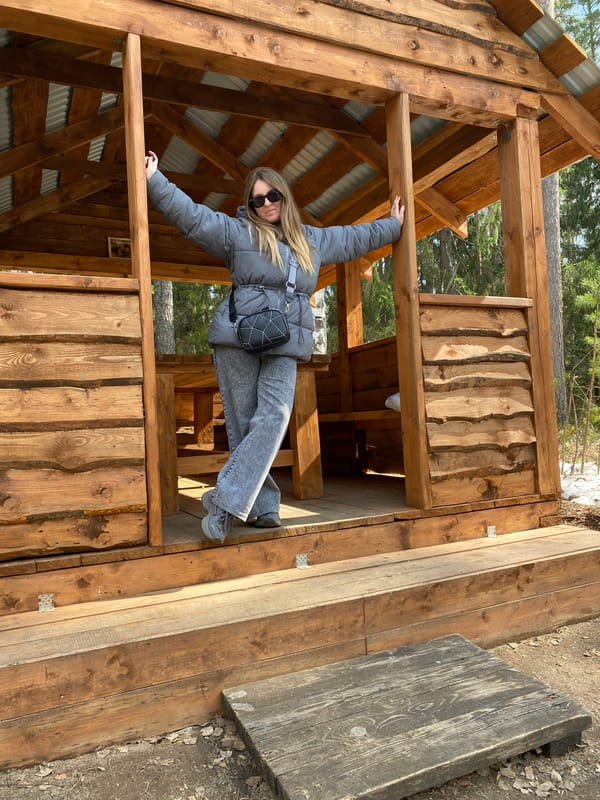 Woman takes selfies with dog in Russian park
