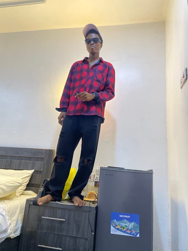 Young men hang out, take selfies in Awka room
