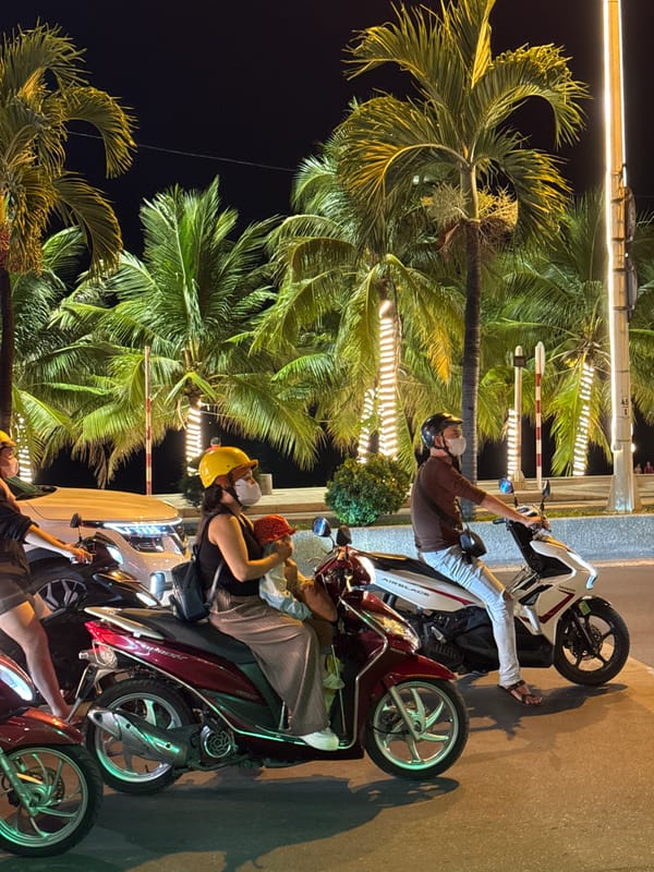 Nha Trang's nighttime promenade: fountains, motorbikes, and street life