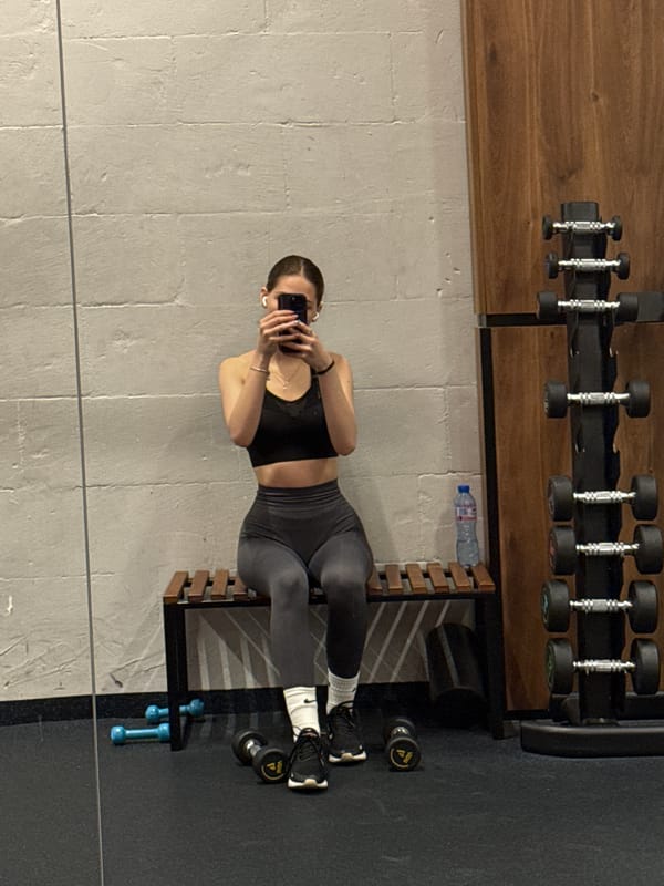 Woman takes mirror selfies during gym workout in Sofia