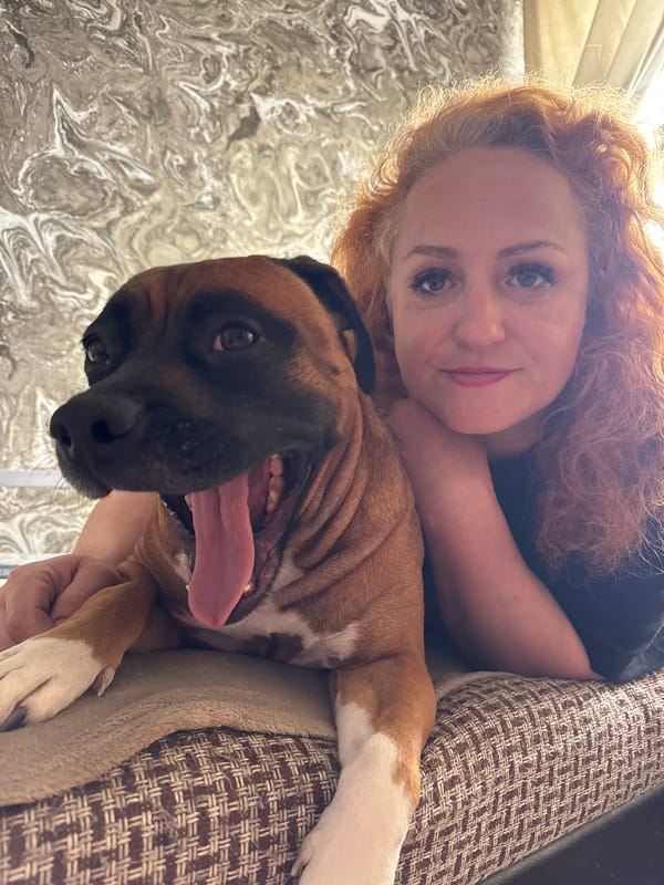 Woman and dog share quiet morning moments in Chaikovsky home