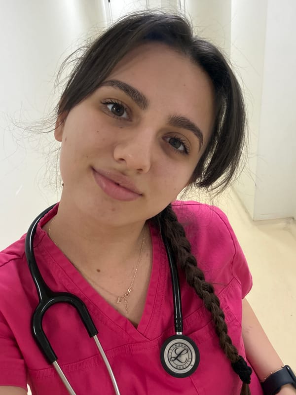 Healthcare worker in pink scrubs photographed in Sofia