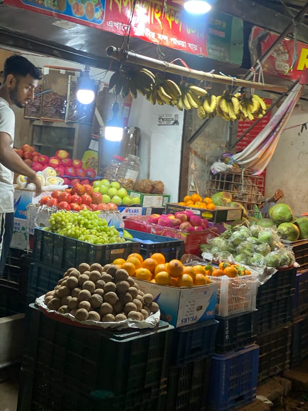 Dhaka street vendor and baby captured in afternoon memories