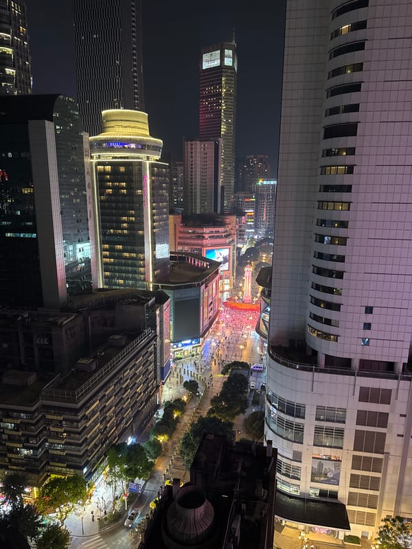 Evening street food vendors serve skewers in Yuzhong District