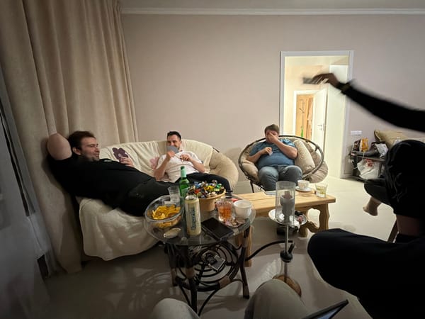 Four people gather in Kuyuki living room