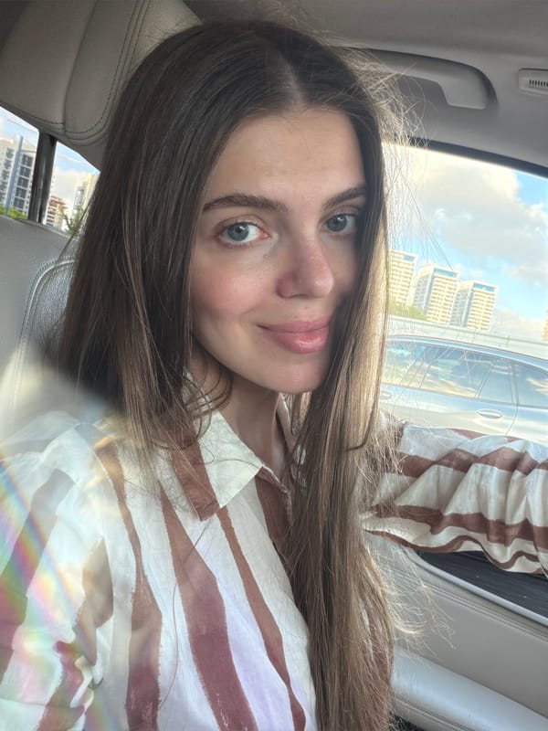 Car selfie in Rishon LeZion with urban backdrop