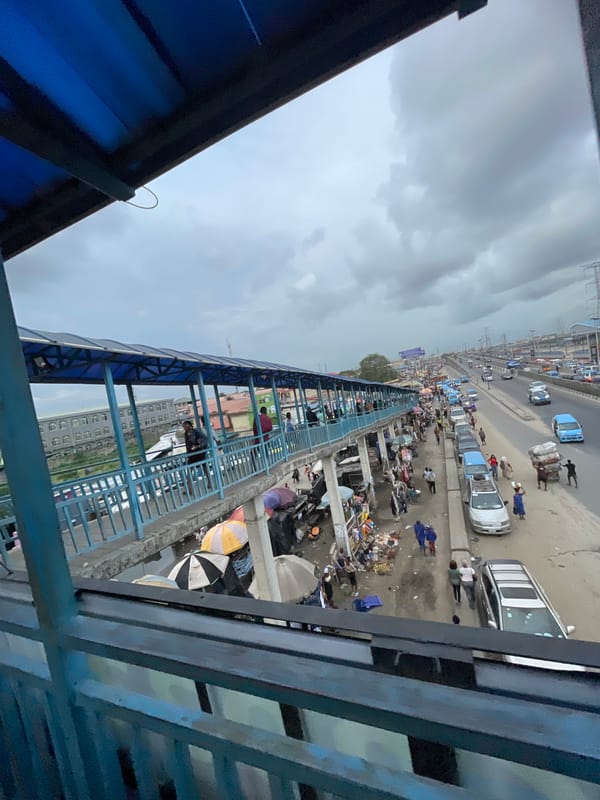 Pedestrian bridge witness captures busy Lekki street market activity