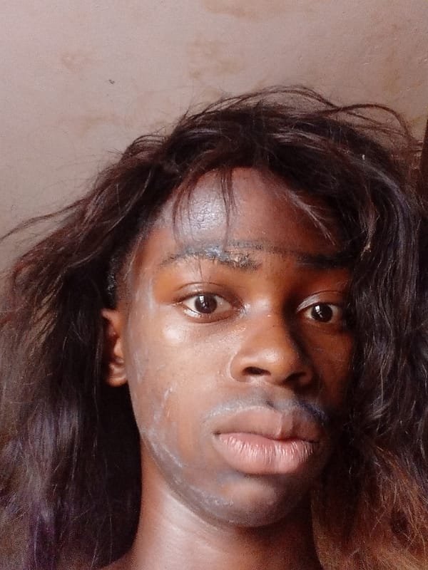 Young man documents traditional body painting session in Onitsha