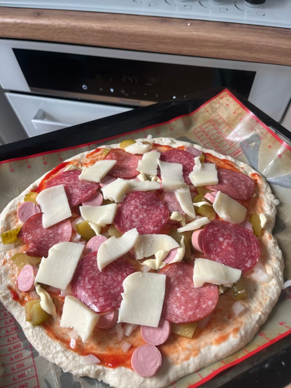 Homemade pizza and dolmades from a Voronezh kitchen